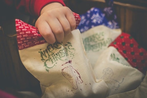 hand holding a christmas bag of candy