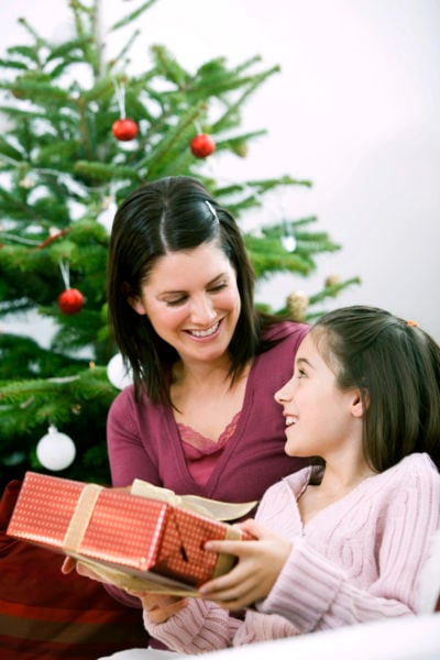 mom and daughter exchanging gift