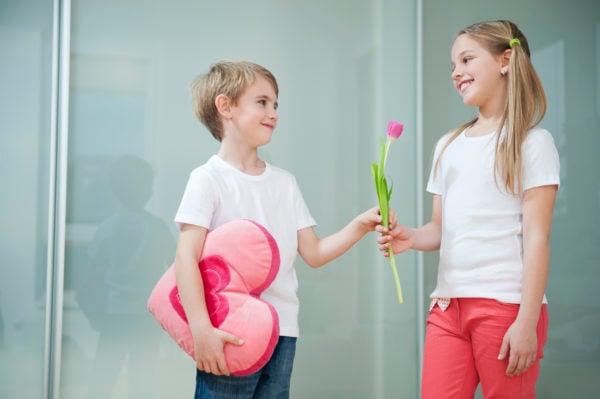 boy and girl exchanging valentines gifts