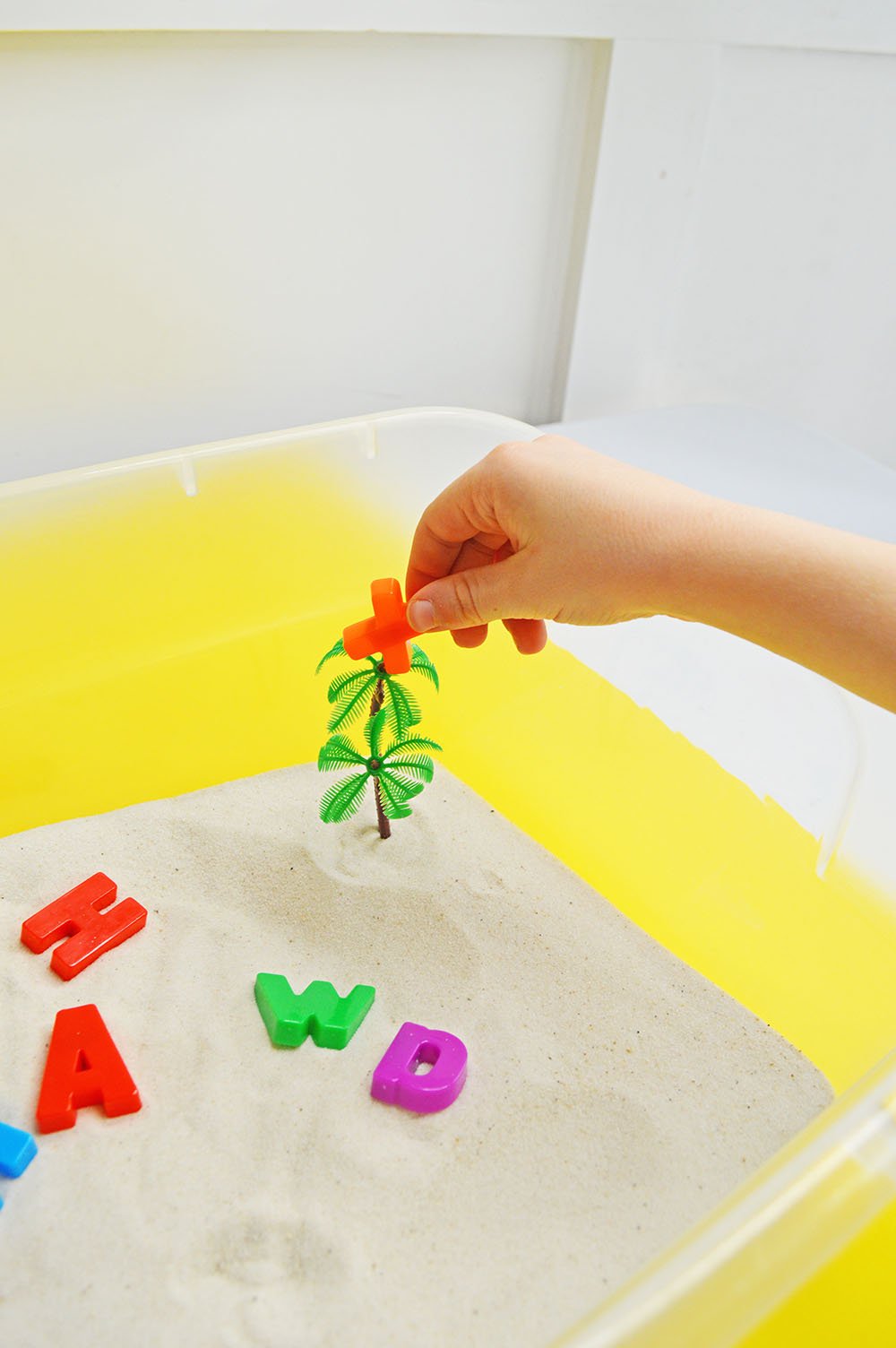 Child's Hands in Sensory Bin