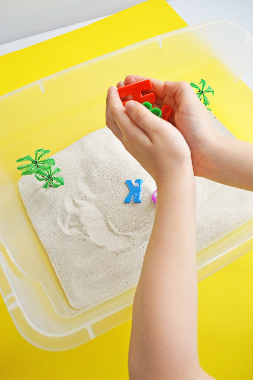 Child's Hands Playing in Sensory Bin