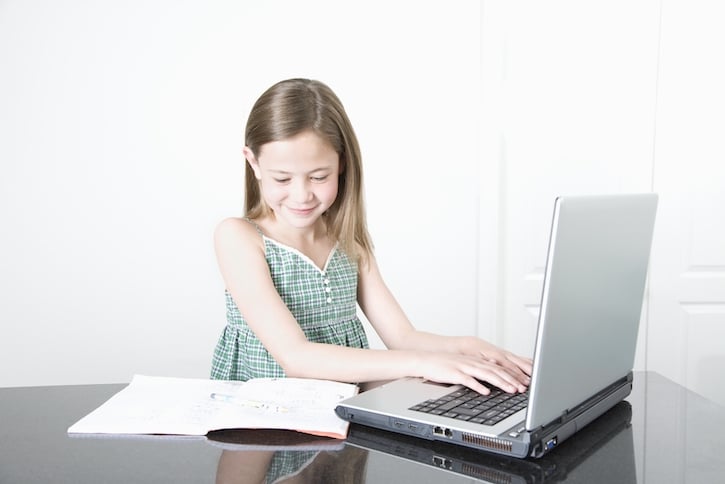 Girl Doing Homework on Laptop Computer