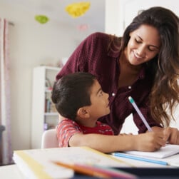 Mother Homeschooling Son - Hispanic