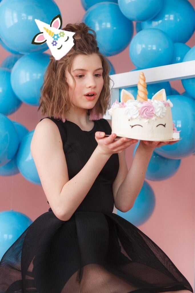 Unicorn Party Hat on Girl with Cake