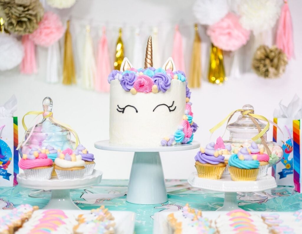 unicorn birthday party with cake and decorations