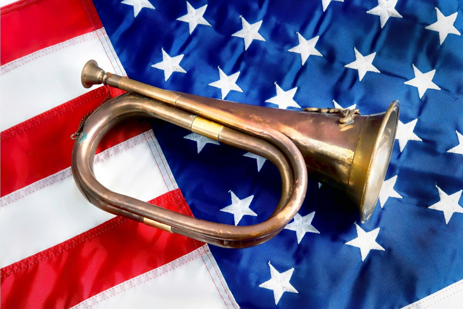 military bugle on American flag