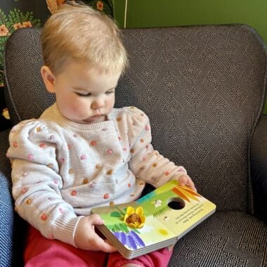 Child reading book.