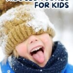 Boy in winter hat and scarf with snow on head laughing. Text overlay says WINTER RIDDLES AND JOKES FOR KIDS.