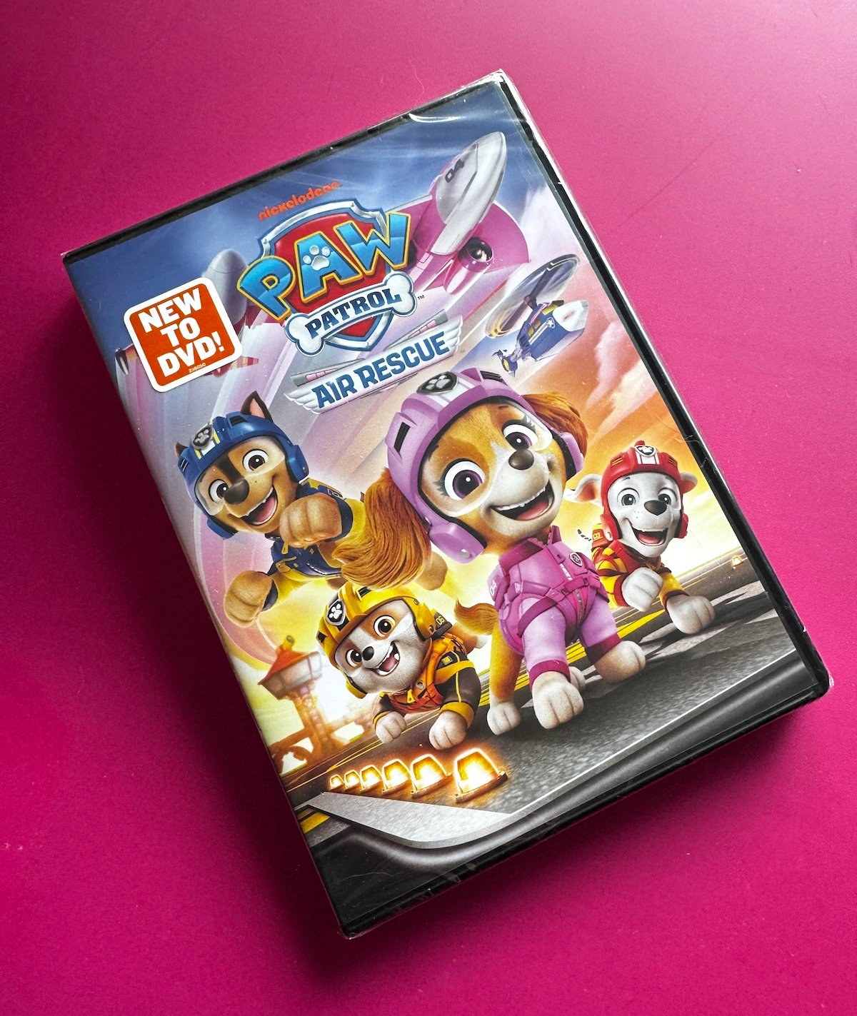 Paw Patrol Air Rescue DVD on pink background.
