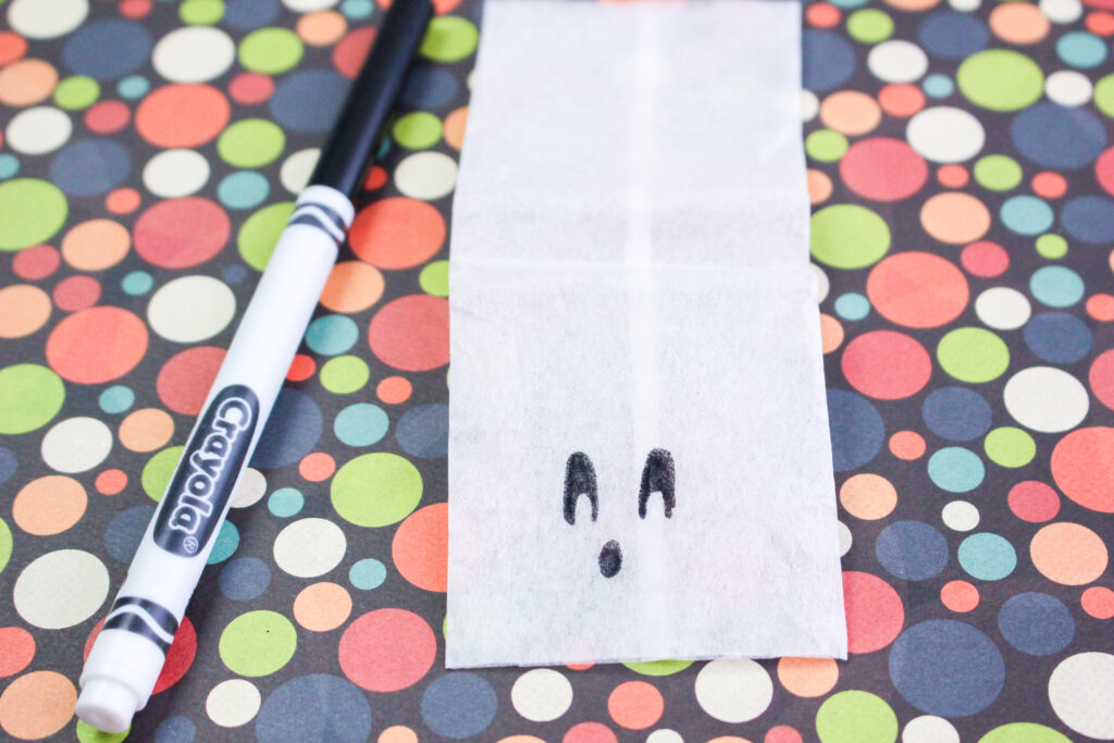 drawing a face at the bottom of the tea bag