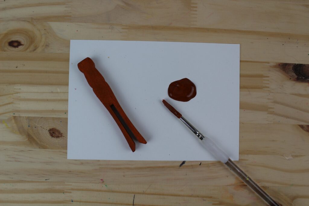 painting the clothespins brown